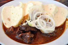 Hungarian goulash with dumplings and onion